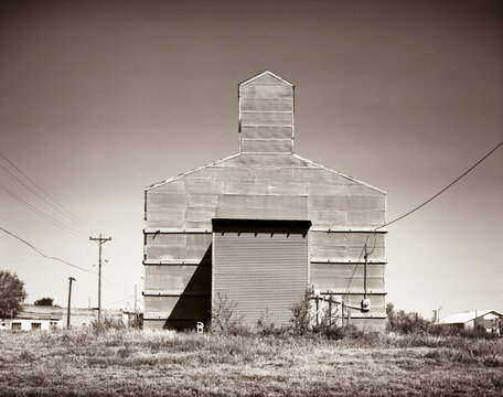 A corrugated metal building with an iconic shape is the tallest thing for miles on the plains of Oklahoma.