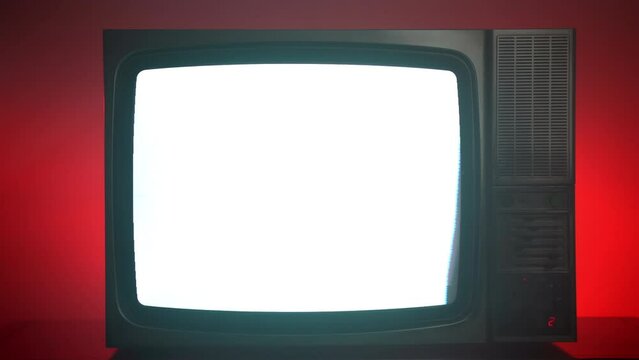 Old vintage TV on red background, blinking horizontal stripes on television screen, bad satellite signal on antique TV, broken television with noise and bars interference on monitor display