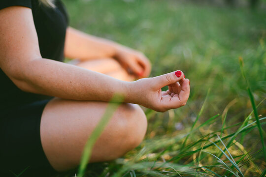 Woman practising yoga outdoors