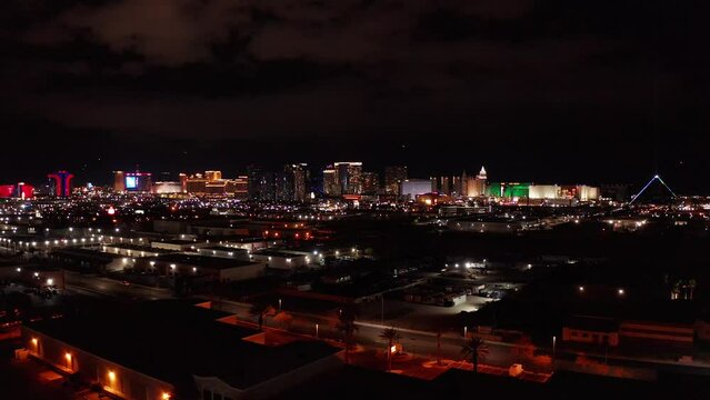 Aerial wide dolly shot of the central and south areas of the Las Vegas Strip at night. 4K