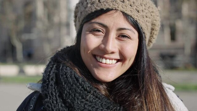 Hispanic Latin American Young Woman smiling in the city. Female girl from Andean Ethnicity - Bolivia
