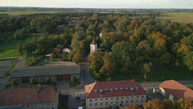 Wonderful aerial view flight speed ramp Hyperlapse motionlapse timelapse of
Village Church Paretz Brandenburg Havelland Germany summer evening 2022. High Quality 4k Cinematic footage