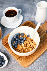 Granola with nuts and a cup of coffee for breakfast. Balanced diet for vegetarians or vegans