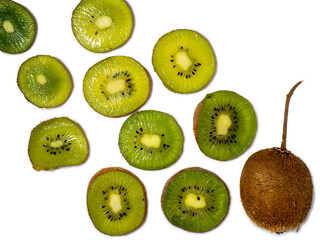 Round kiwi slices on a white background. The concept of juicy ripe fruit. Place for an inscription.  raw food diet. Ingredient for many dishes. Southern fruit.