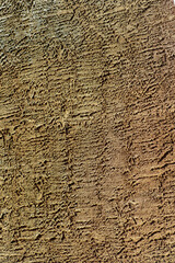 Dark stucco exterior on side of building or in industrial area with cement or concreate facade as a texture