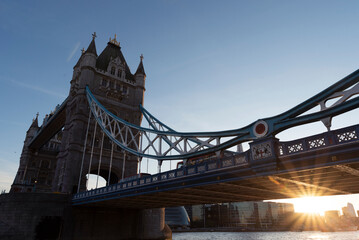 Fototapeta na wymiar Tower Bridge in UK with sunset in beautiful day. Capital city in Great Britain in the evening. Tourism and attraction in Europe.