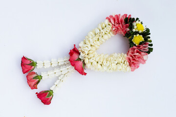 Jasmine garland with rose flower on white background.