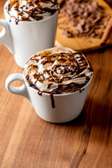 Hot chocolate. Irish coffee or spiked hot chocolate. Classic holiday drink made with hot coffee, Irish cream flavored liquor, mocha, Kahula, chocolate and topped with whipped cream and a cherry.