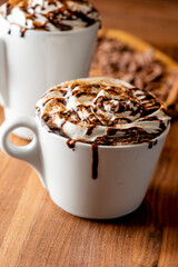 Hot chocolate. Irish coffee or spiked hot chocolate. Classic holiday drink made with hot coffee, Irish cream flavored liquor, mocha, Kahula, chocolate and topped with whipped cream and a cherry.