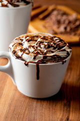 Hot chocolate. Irish coffee or spiked hot chocolate. Classic holiday drink made with hot coffee, Irish cream flavored liquor, mocha, Kahula, chocolate and topped with whipped cream and a cherry.