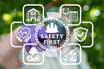 Doctor or laboratory assistant using virtual touchscreen presses inscription: SAFETY FIRST. Work...