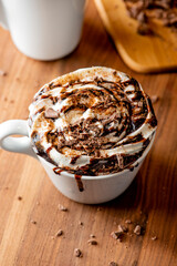 Hot chocolate. Irish coffee or spiked hot chocolate. Classic holiday drink made with hot coffee, Irish cream flavored liquor, mocha, Kahula, chocolate and topped with whipped cream and a cherry.