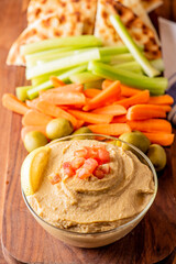 Hummus, Tzatziki served with pita bread and mezze. Greek and Mediterranean dips and spreads. Traditional classic Turkish and Greek cuisines. Hummus, Tzatziki served with pita bread and mezze. 