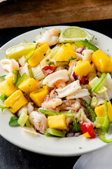 Lobster ceviche. Ceviche made with fresh diced seafood, shrimp, scallops, sea bass and lobster marinated in lime juice, cilantro, jalapeños, salsa salt and pepper. Served with fried tortilla chips.