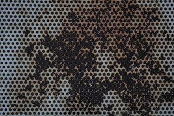 Rusty metal grate. iron texture. perforated metal sheet, pattern. Hole Mesh Pattern.