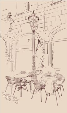 The background is decorated with views of the old city and street cafes. Hand drawn vector illustration. Image of tables and a vintage street lamp in beige shades. Leisure and travel, Germany, France,