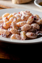 Gnocchi. Pasta sautéed with truffles garlic, onions, olive oil and fresh herbs and spices. Classic American steakhouse or French bistro appetizer or side dish.