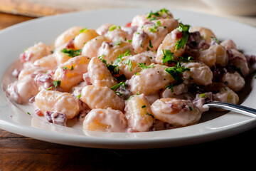 Gnocchi. Pasta sautéed with truffles garlic, onions, olive oil and fresh herbs and spices. Classic American steakhouse or French bistro appetizer or side dish.