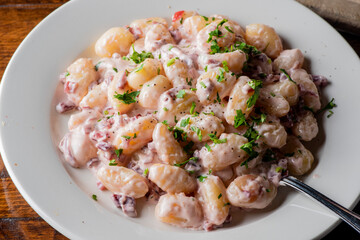 Gnocchi. Pasta sautéed with truffles garlic, onions, olive oil and fresh herbs and spices. Classic American steakhouse or French bistro appetizer or side dish.