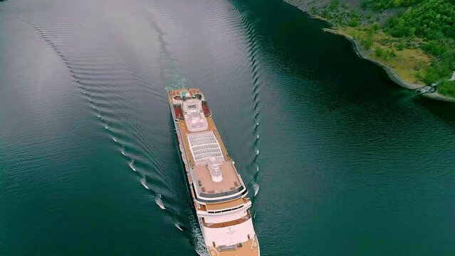 Aerial shot of huge ferry making ripples in the water