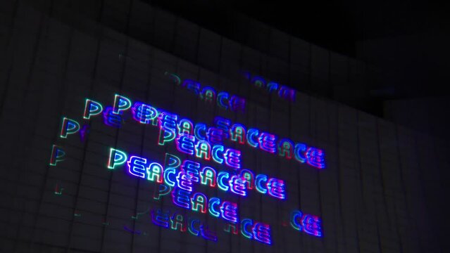 hallucinogenic positive messages of peace, love, and unity were projected onto a wall of an art gallery positive aura booster progressive psytrance psybient vibrations kaleidoscope visuals