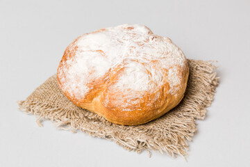 Assortment of freshly baked bread with napkin on rustic table top view. Healthy unleavened bread. French bread