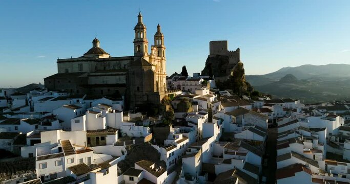 Flying On The Neoclassic Cathedral At Olvera Village During Sunrise In C&aacute;diz, Andalusia, Spain. Aerial Drone Shot