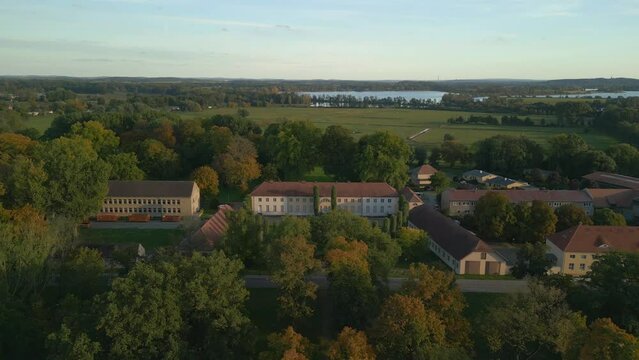 Paretz castle, manor house, chateau at summer evening. Gorgeous aerial view flight panorama overview drone brandenburg havelland Germany at summer evening 2022. High Quality 4k Cinematic footage