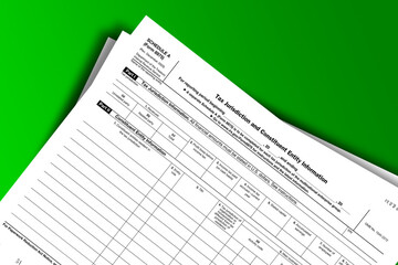 Obraz premium Form 8975 (Schedule A) documentation published IRS USA 12.18.2020. American tax document on colored