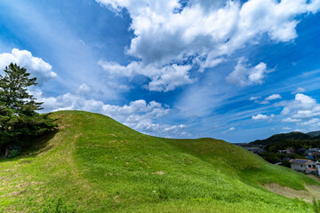 Fototapeta na wymiar Hill - ancient tomb - and blue sky in Saga prefecture, Japan.