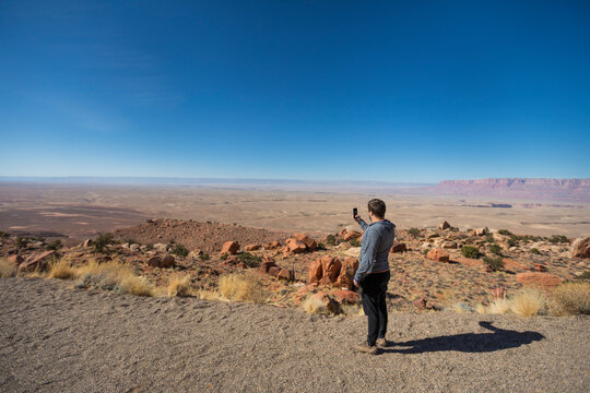 Tourist taking photos in Antelope Pass, Arizona, USA