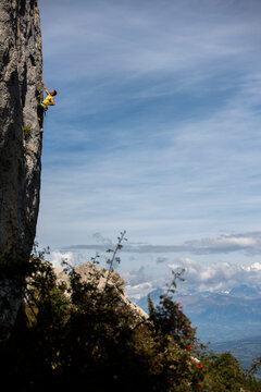 Men climbing a sport route on limestone in Ceuse, France.