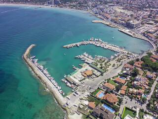 Fototapeta premium Drone view of Çeşme Yıldızburnu beach and boats in the harbor
