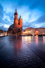 Naklejka na ściany i meble St. Mary's Basilica on the main square in Krakow in the morning. Beautiful place in Cracow. 