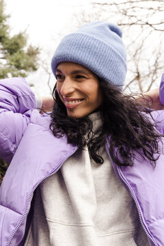Model wearing winter beanie and puffer