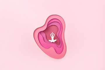 Paper anatomical heart with human doing yoga.