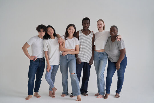 Multiracial boyfriends and girlfriends hugging and smiling