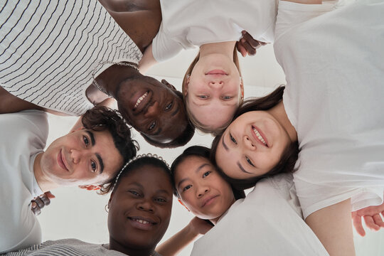 Diverse friends standing in circle