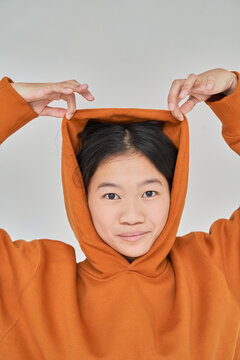 Young Asian woman playing with hood