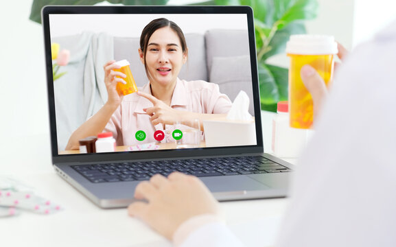 Asian woman patient make video call counselling doctor about healthcare by laptop computer, Telemedicine, Pharmacist