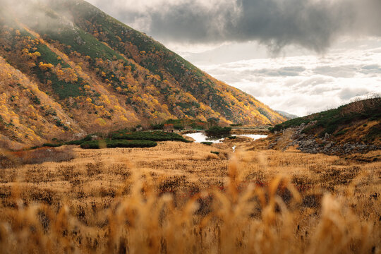 Scenic landscape of mountain valley under cloudy sky