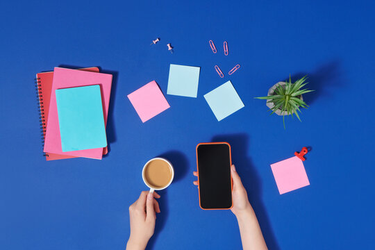 Modern workspace with coffee cup and smartphone