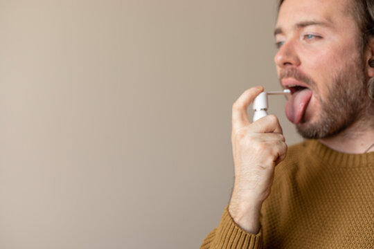 man using an inhaler