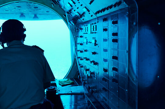 Captain piloting a sub underwater