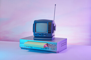 Vintage TV with book in old VCR video player.