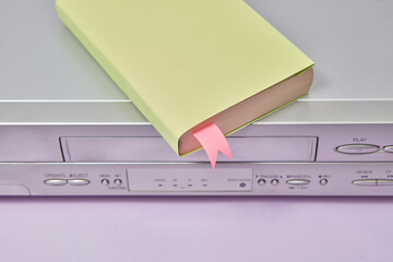 VCR video player and yellow book.