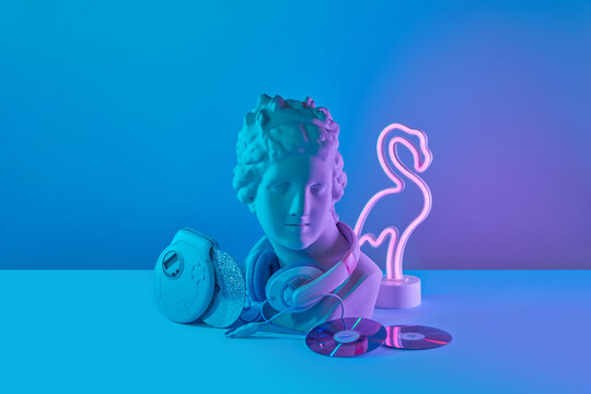 Bust with headphones, player and flamingo lamp.