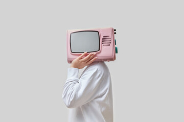 Woman with pink retro TV as head.