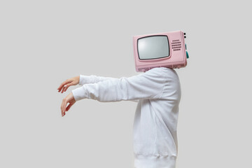 Retro TV as head of woman with zombie arms.