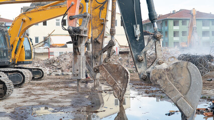 Construction machinery in construction site. Excavator and other heavy machineries.